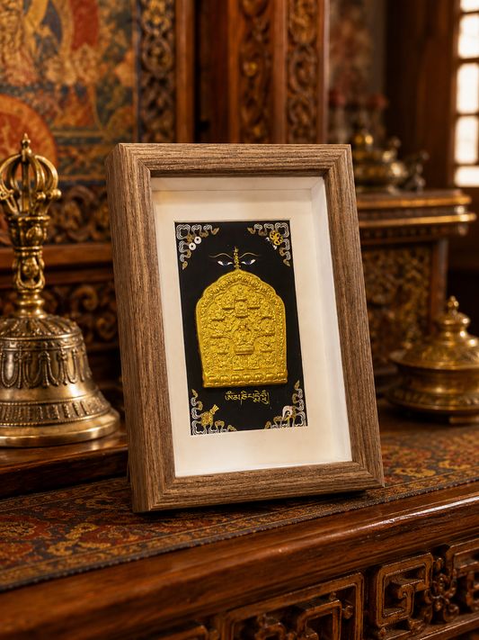 Framed Tibetan Padmasambhava clay relief on a carved table