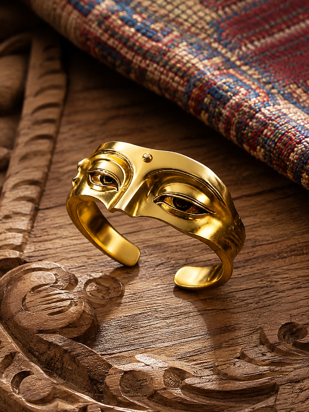 Detailed view of Tibetan-inspired Buddha face open-band ring