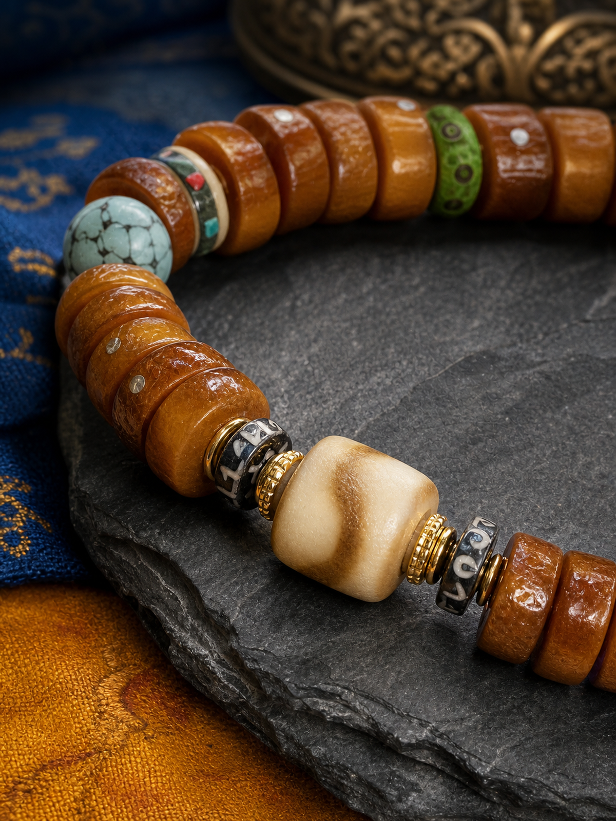 Tibetan Flat Bone Mala Bracelet with Tiger-Tooth and Turquoise-Tone Accents — detail view