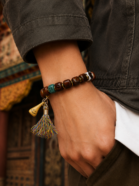 Tibetan Bone Mala Bracelet with Smiling Face Bead — worn on wrist