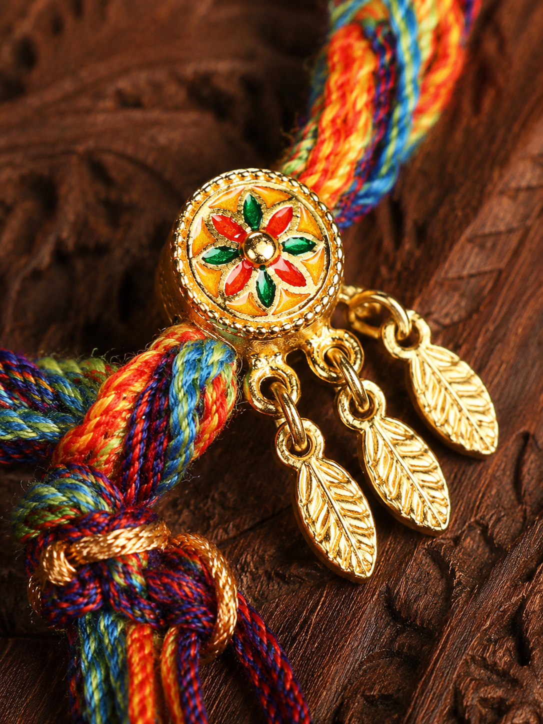 Close-up of handwoven cord and dreamcatcher leaf charms