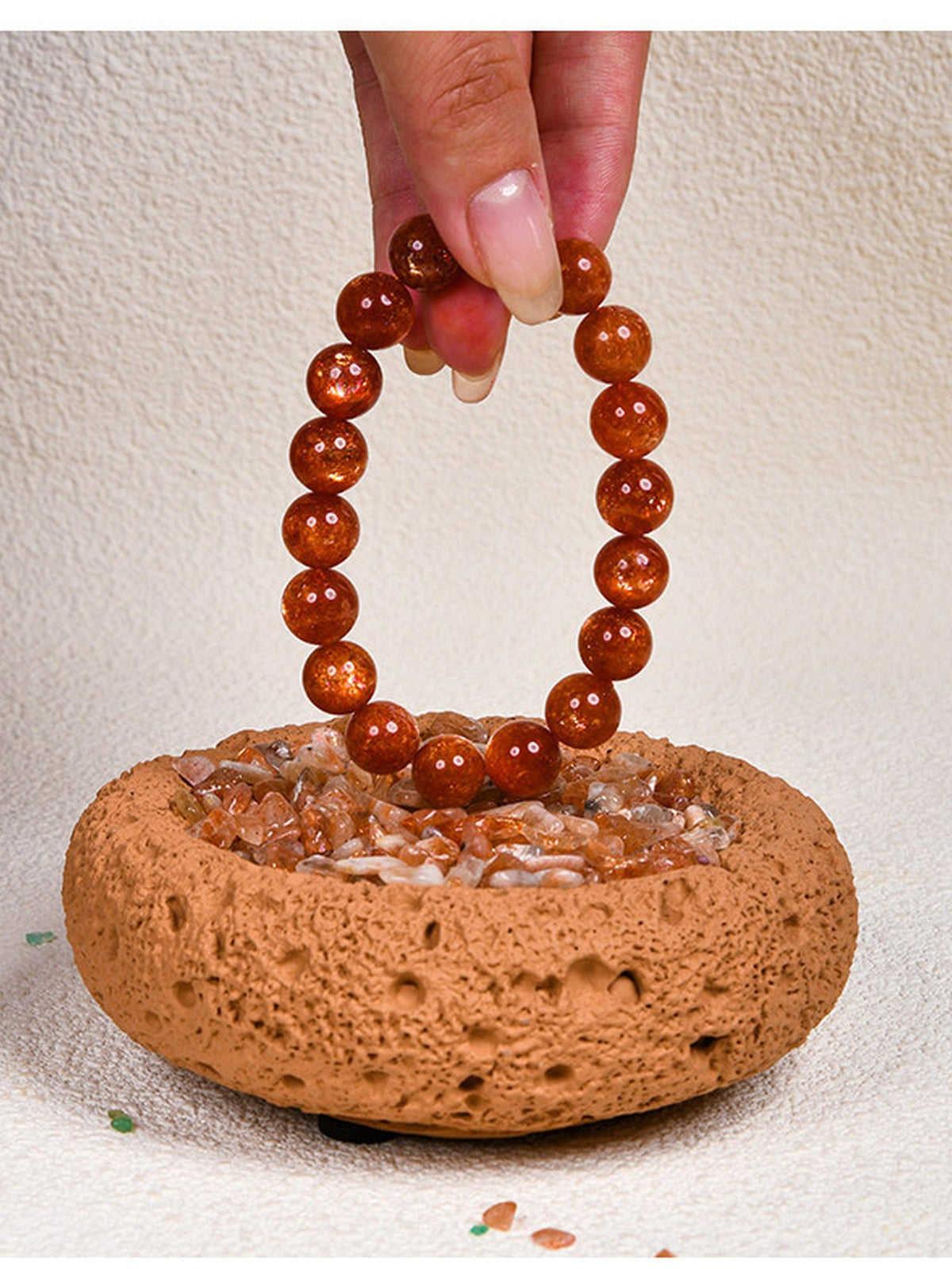 Crystal bracelets resting in cleansing bowls