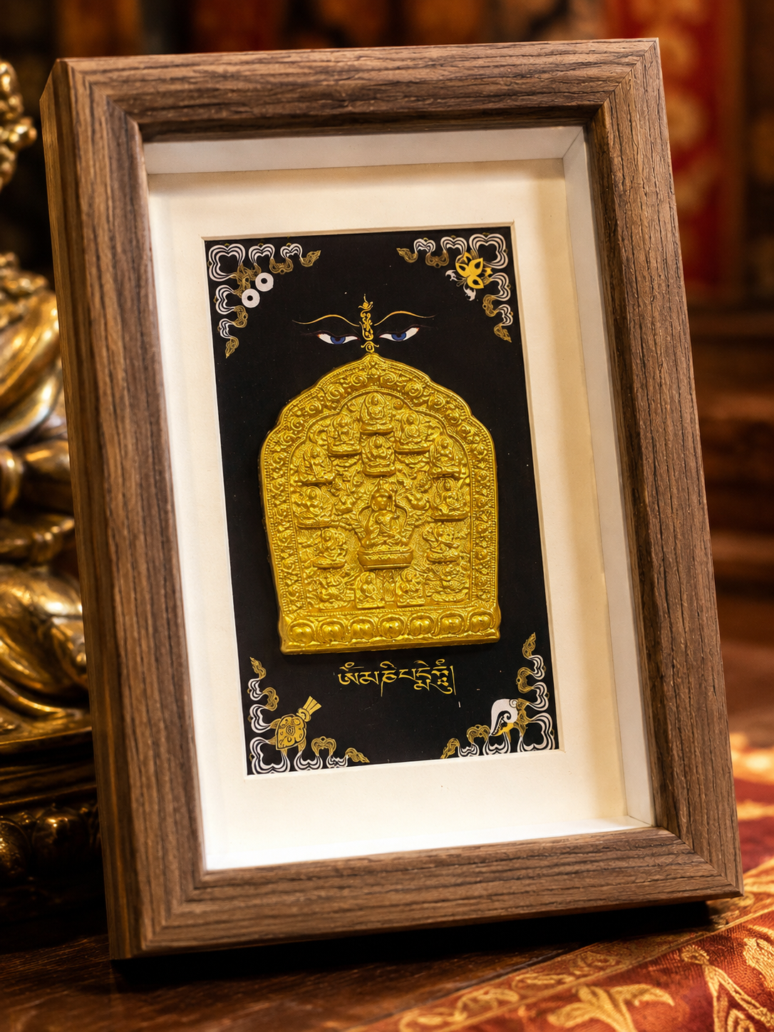 Padmasambhava Eight Manifestations clay relief in a wood-tone frame