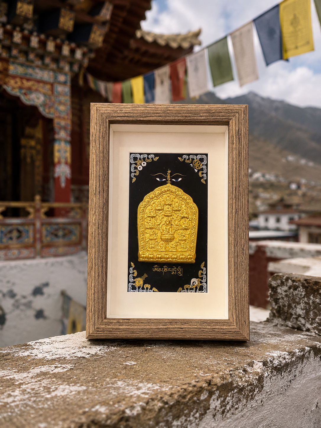 Framed Padmasambhava clay relief in a mountain temple setting