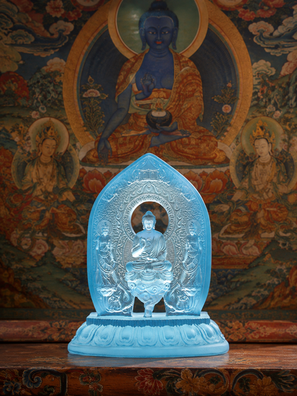 Plain Medicine Buddha triad statue before a thangka