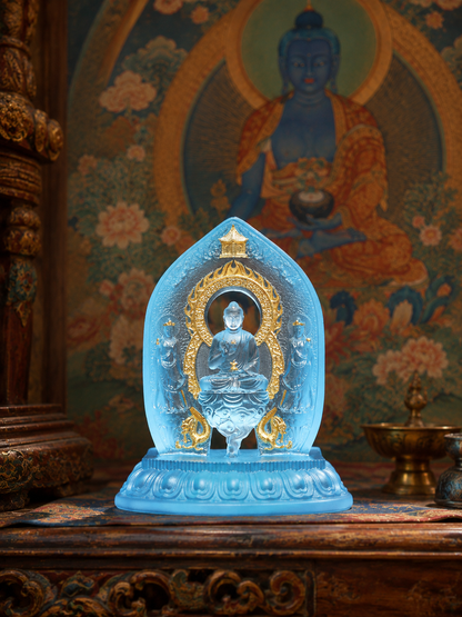 Gilded Medicine Buddha triad statue on a carved table