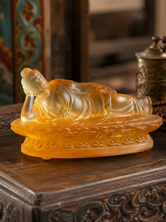 Side view of amber reclining Buddha statue