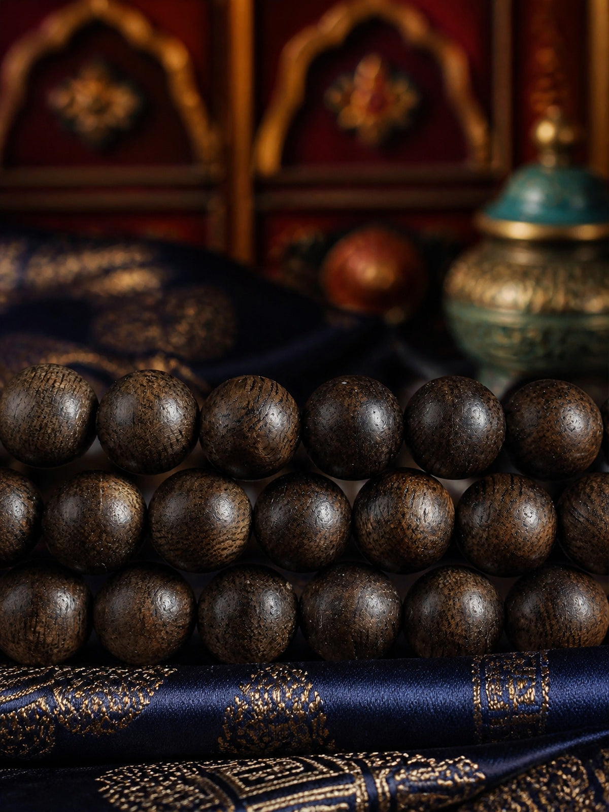 Close-up of dark agarwood bead grain and texture
