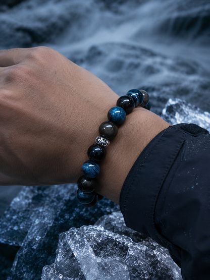 Blue tiger’s eye and obsidian bracelet worn on the wrist