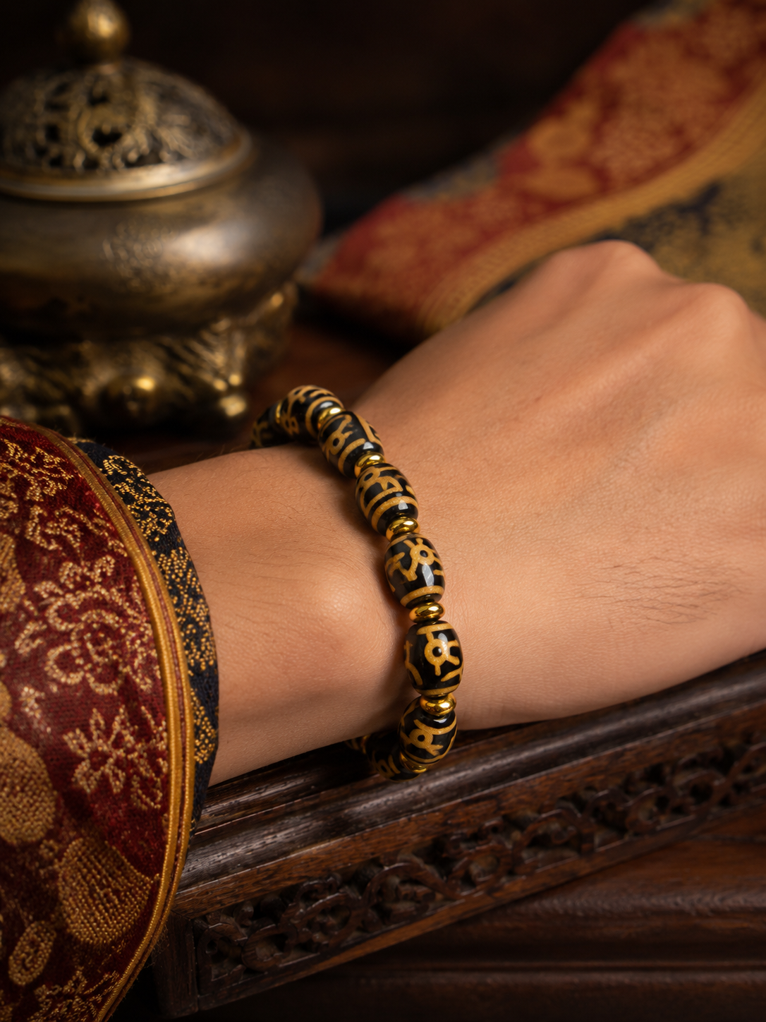 Tibetan Sacred Vase Dzi Bracelet — wearing view