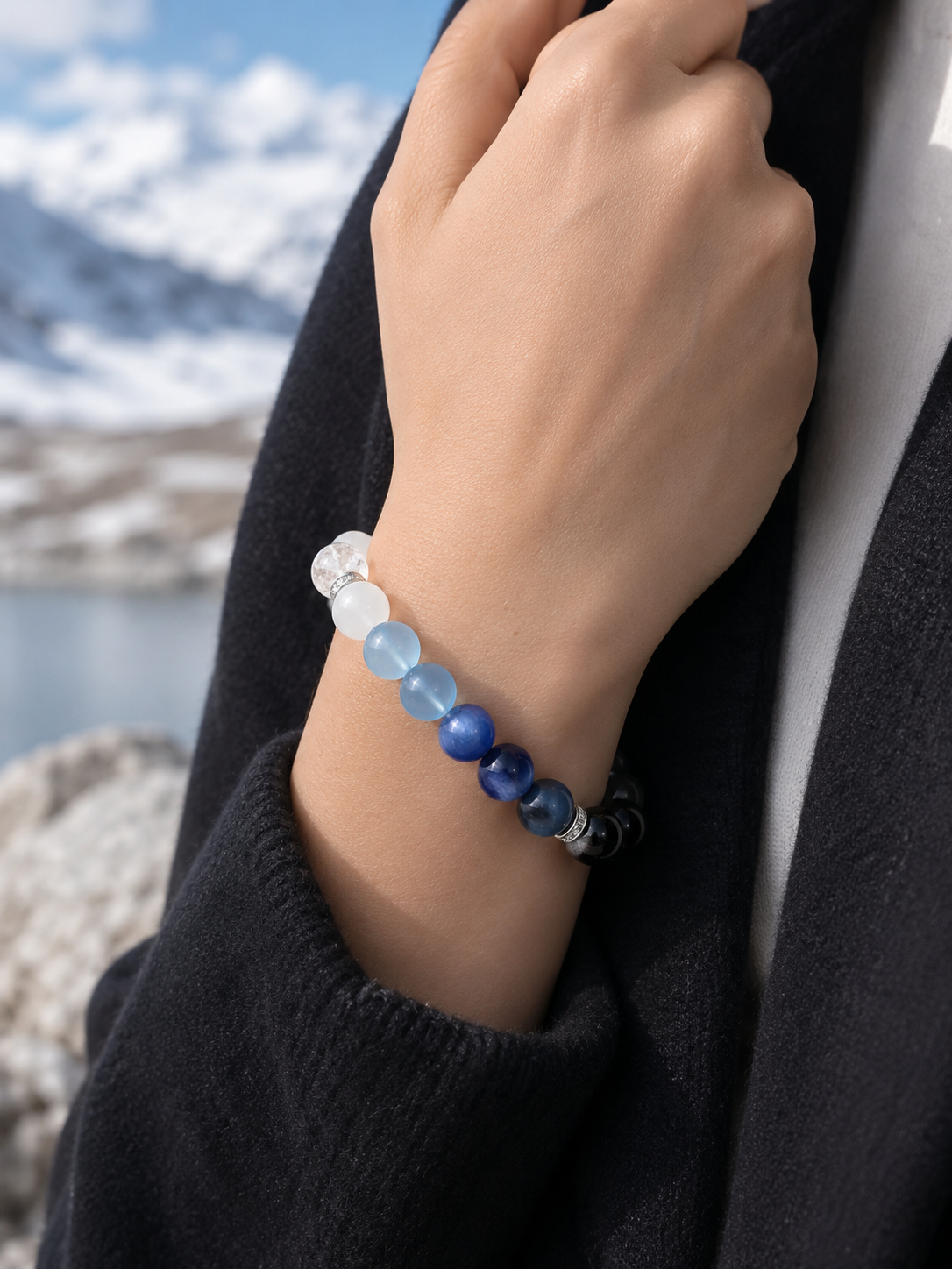 Five-Element blue crystal bracelet worn on the wrist, showing the light-to-dark bead arrangement