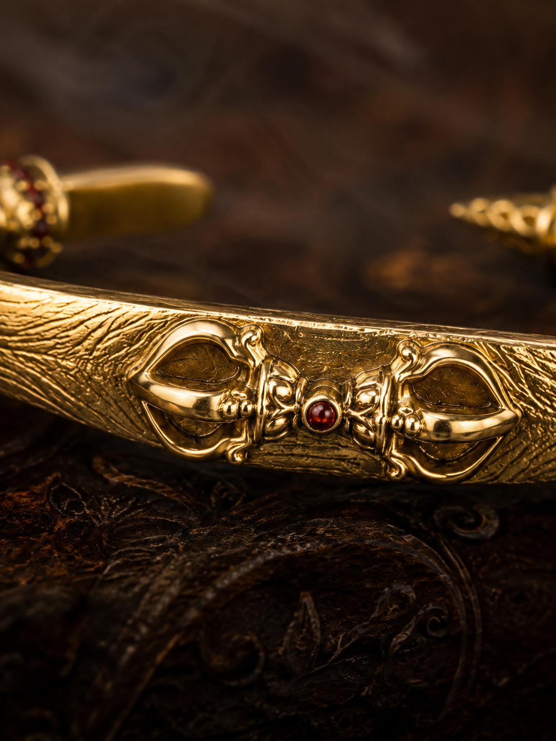 Tibetan Vajra Guardian Bangle — gold-tone detail view