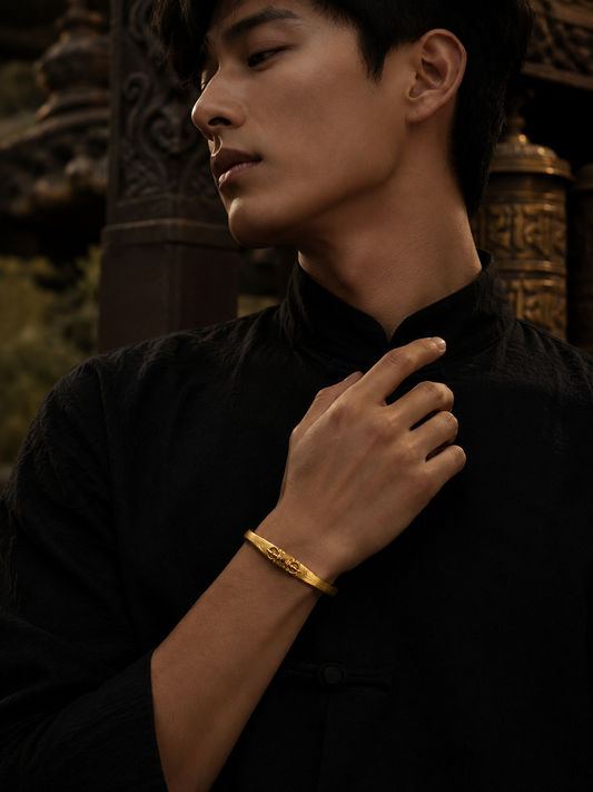 Tibetan Vajra Guardian Bangle — gold-tone wearing view