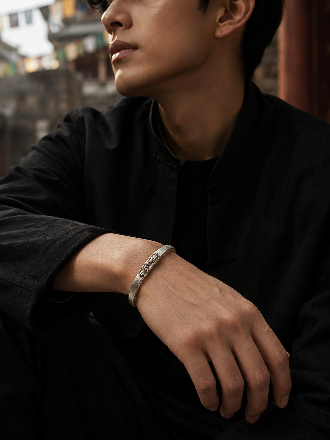 Tibetan Vajra Guardian Bangle — silver-tone wearing view