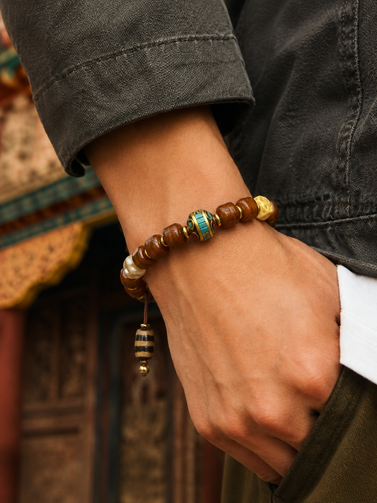 Tibetan Yak Bone Mala Bracelet with Dzi-Style Bead — worn on wrist