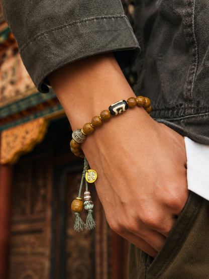 Tibetan Yak Bone Mala Bracelet with Cross Charm — worn on wrist