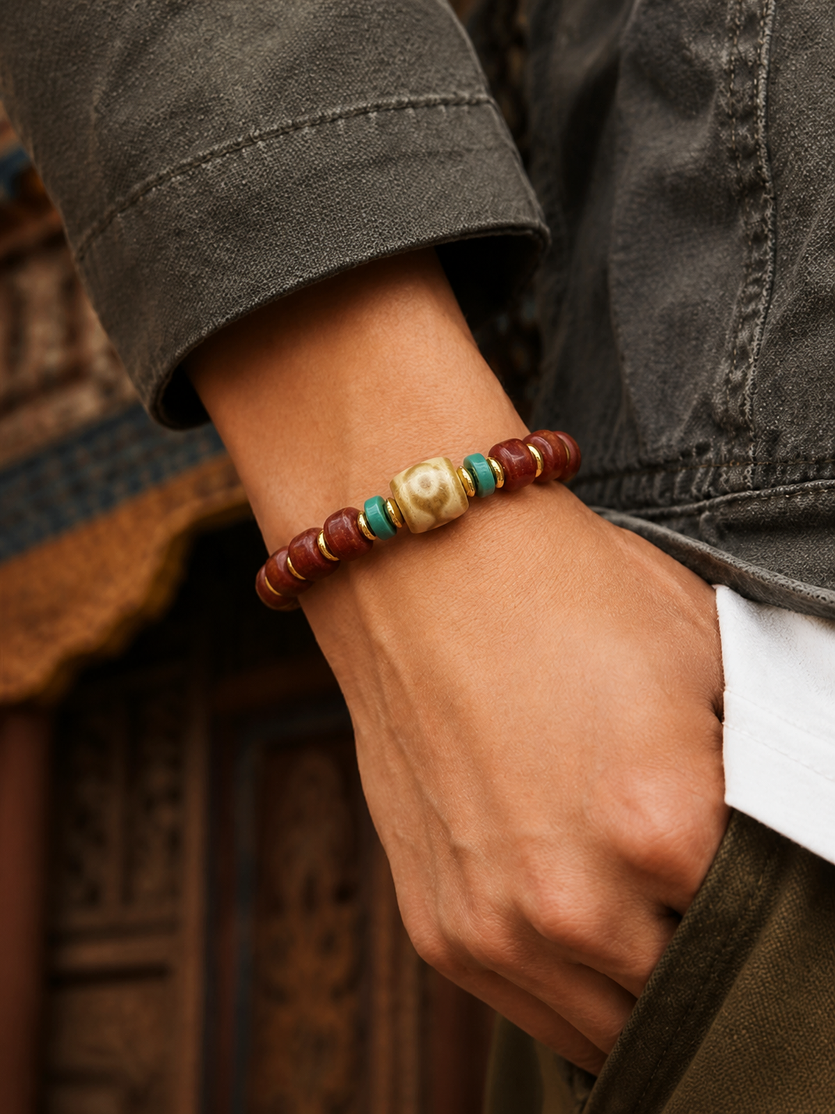 Tibetan Yak Bone Mala Bracelet with Dzi-Style Bead — worn on wrist