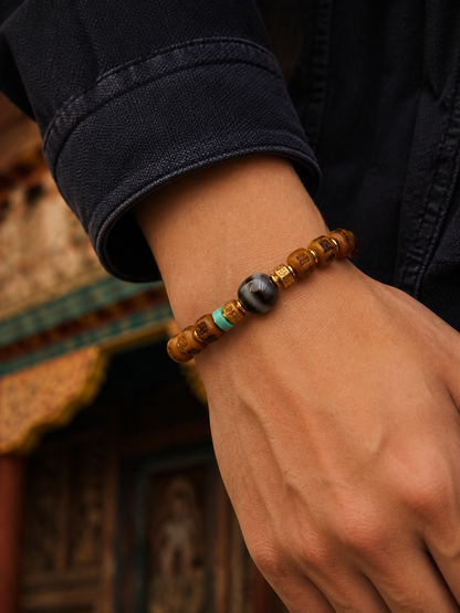 Tibetan Bone Mala Bracelet with Six-Syllable Motif — worn on wrist