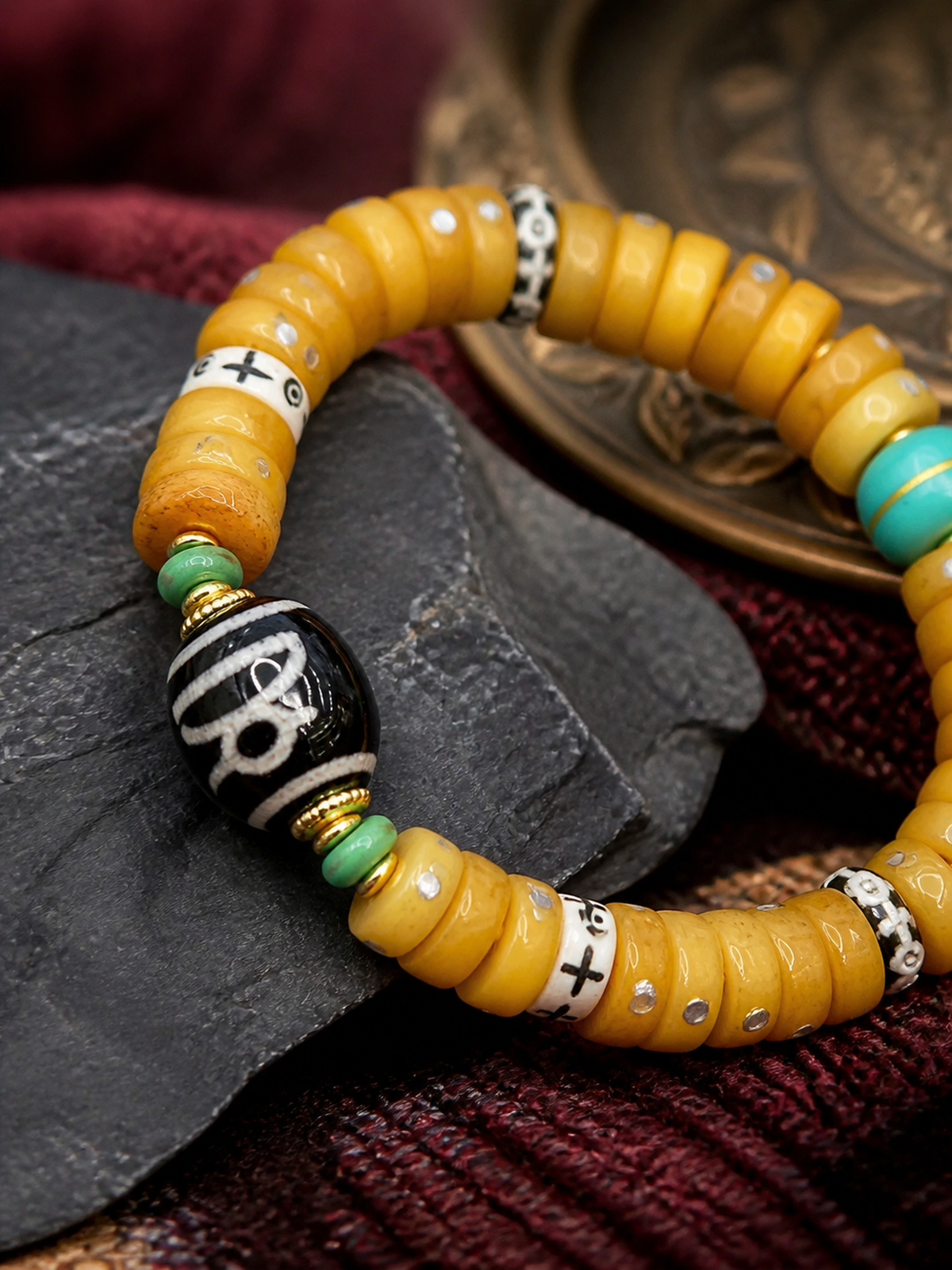 Tibetan Sliced Bone Mala Bracelet with Jambhala Dzi-Style Bead — detail view