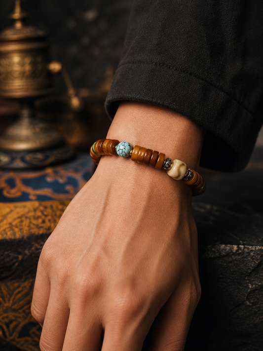 Tibetan Flat Bone Mala Bracelet with Tiger-Tooth and Turquoise-Tone Accents — worn on wrist