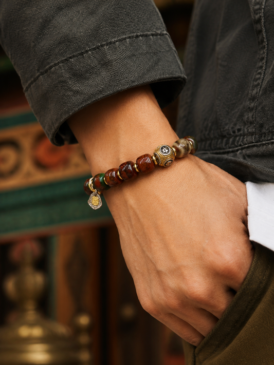 Tibetan Curved Bone Mala Bracelet with Zaki Lhamo Charm — worn on wrist