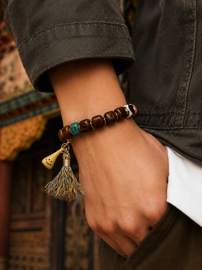 Tibetan Bone Mala Bracelet with Smiling Face Bead — worn on wrist
