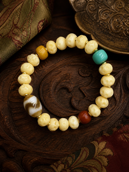 Tibetan Cream-Toned Bone Mala Bracelet with Faceless Buddha and Tiger-Tooth Beads — main view