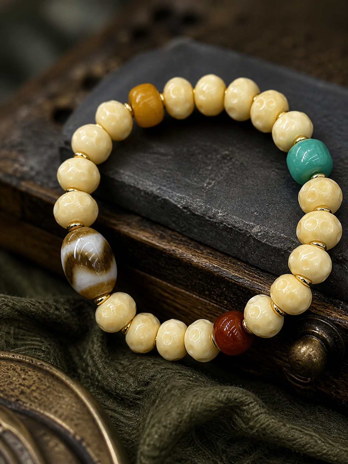 Tibetan Cream-Toned Bone Mala Bracelet with Faceless Buddha and Tiger-Tooth Beads — detail view