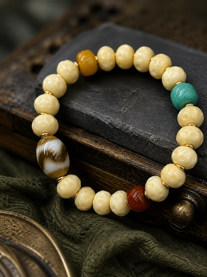 Tibetan Cream-Toned Bone Mala Bracelet with Faceless Buddha and Tiger-Tooth Beads — detail view