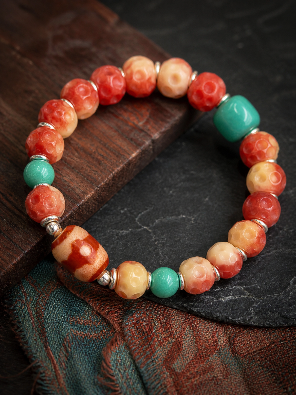 Tibetan Rose-Toned Bone Mala Bracelet with Red Three-Eye Bead — detail view