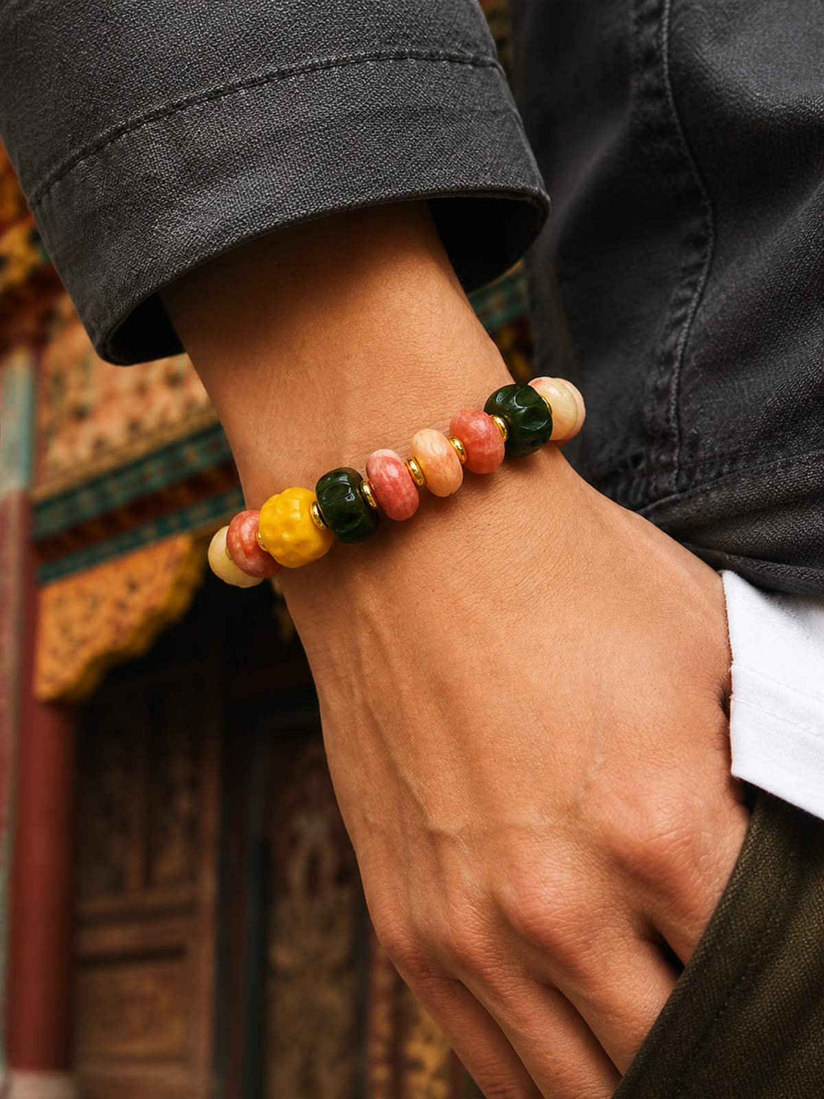 Tibetan Rose-Toned Bone Mala Bracelet with Dragon Motif — worn on wrist