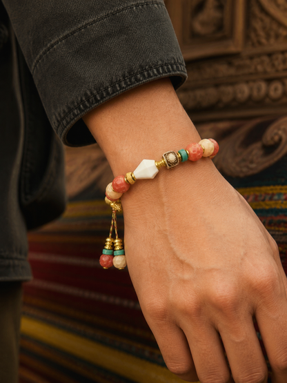 Tibetan Rose-Toned Bone Mala Bracelet with Guru Bead — worn on wrist