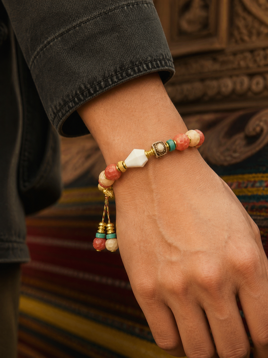 Tibetan Rose-Toned Bone Mala Bracelet with Guru Bead — worn on wrist