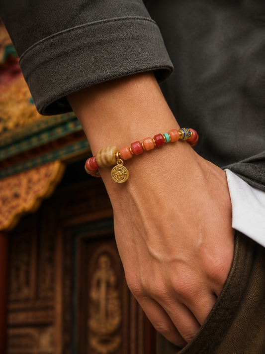 Tibetan Rose-Toned Bone Mala Bracelet with Straight-Cut Tiger-Tooth Beads — worn on wrist