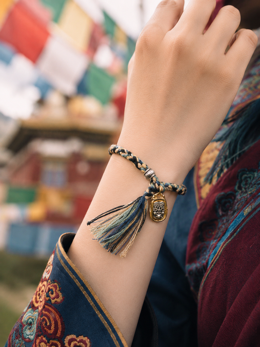 Indigo Tibetan thangka-inspired prosperity woven bracelet worn on wrist