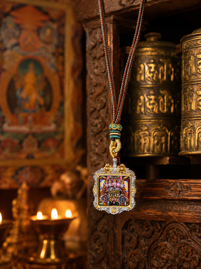 Zaki Lhamo square ghau pendant hanging beside carved wood and metal vessels